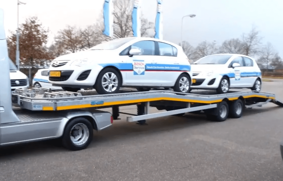 Эвакуатор с двуосным прицепом на 2 авто